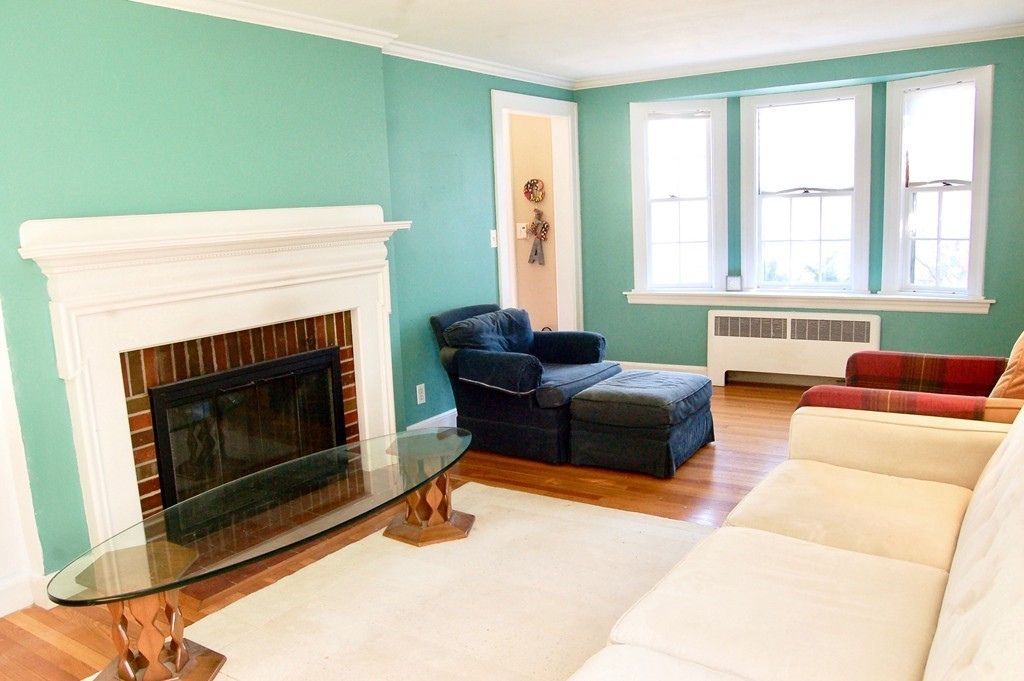 29 Pierrepont Road Newton, MA 02462 - Photo 3 of 20 a living room with furniture and a fireplace