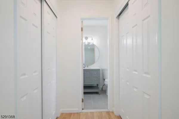 a view of a bathroom from a hallway