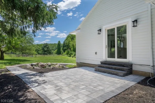a view of a backyard with a garden and plants