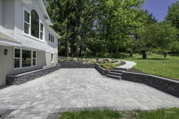 a view of a backyard with sitting area