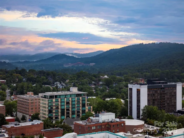 a view of a city with tall buildings