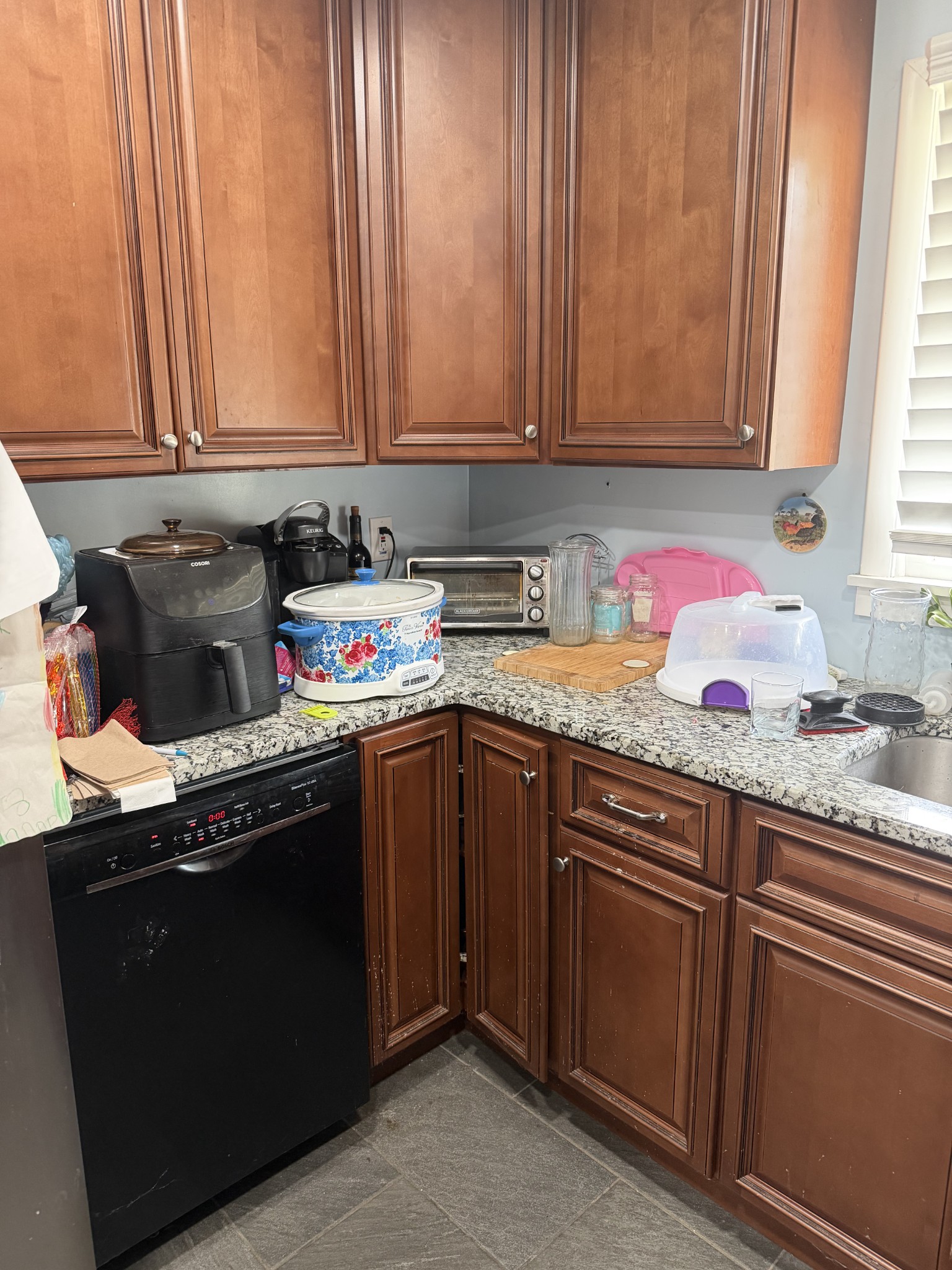901 East College Street Pulaski, TN 38478 - Photo 12 of 20 a kitchen with stainless steel appliances granite countertop a sink stove and cabinets