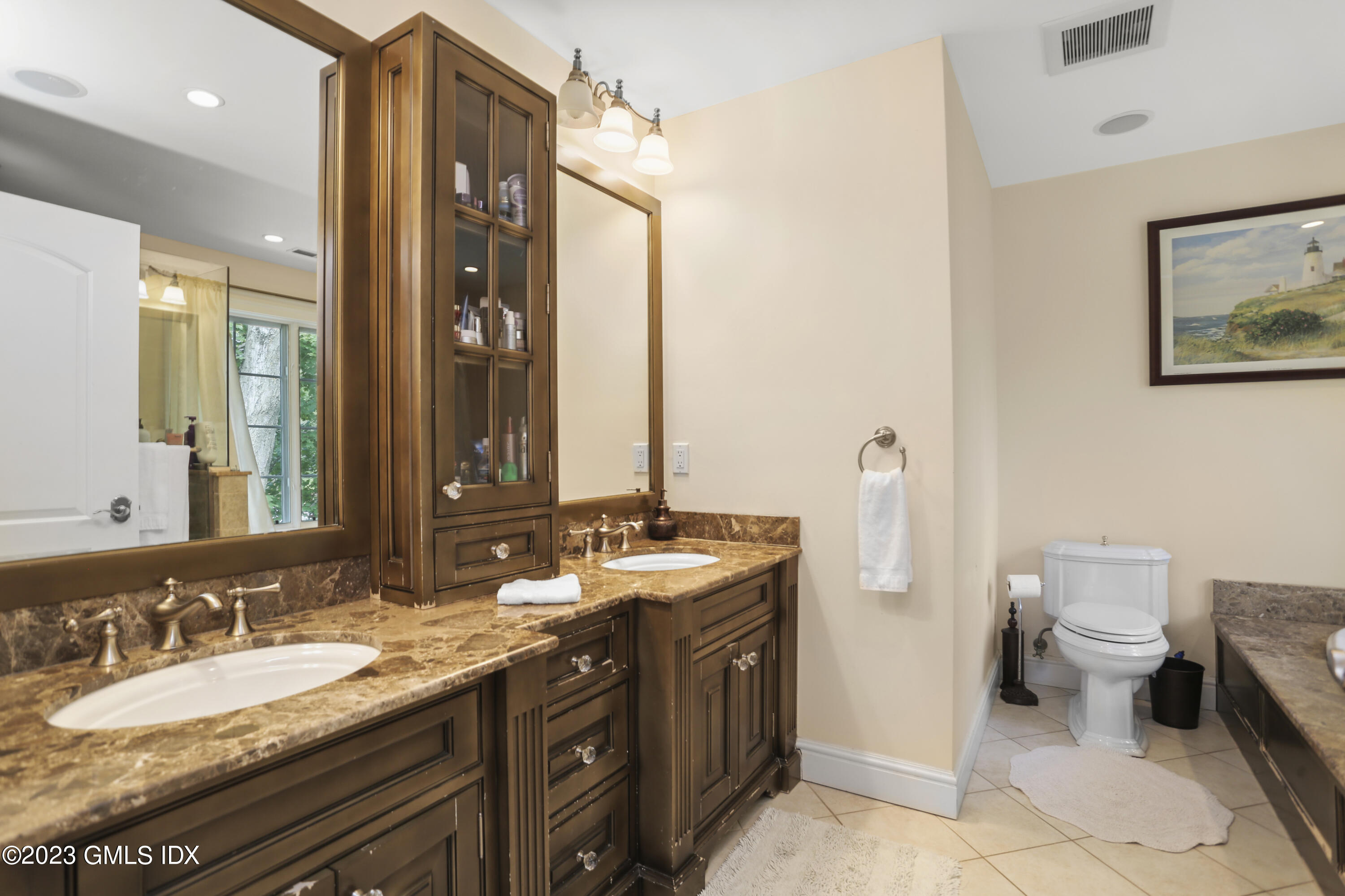 80 Brookside Drive Greenwich, CT 06831 - Photo 12 of 29 a bathroom with a granite countertop sink toilet and mirror