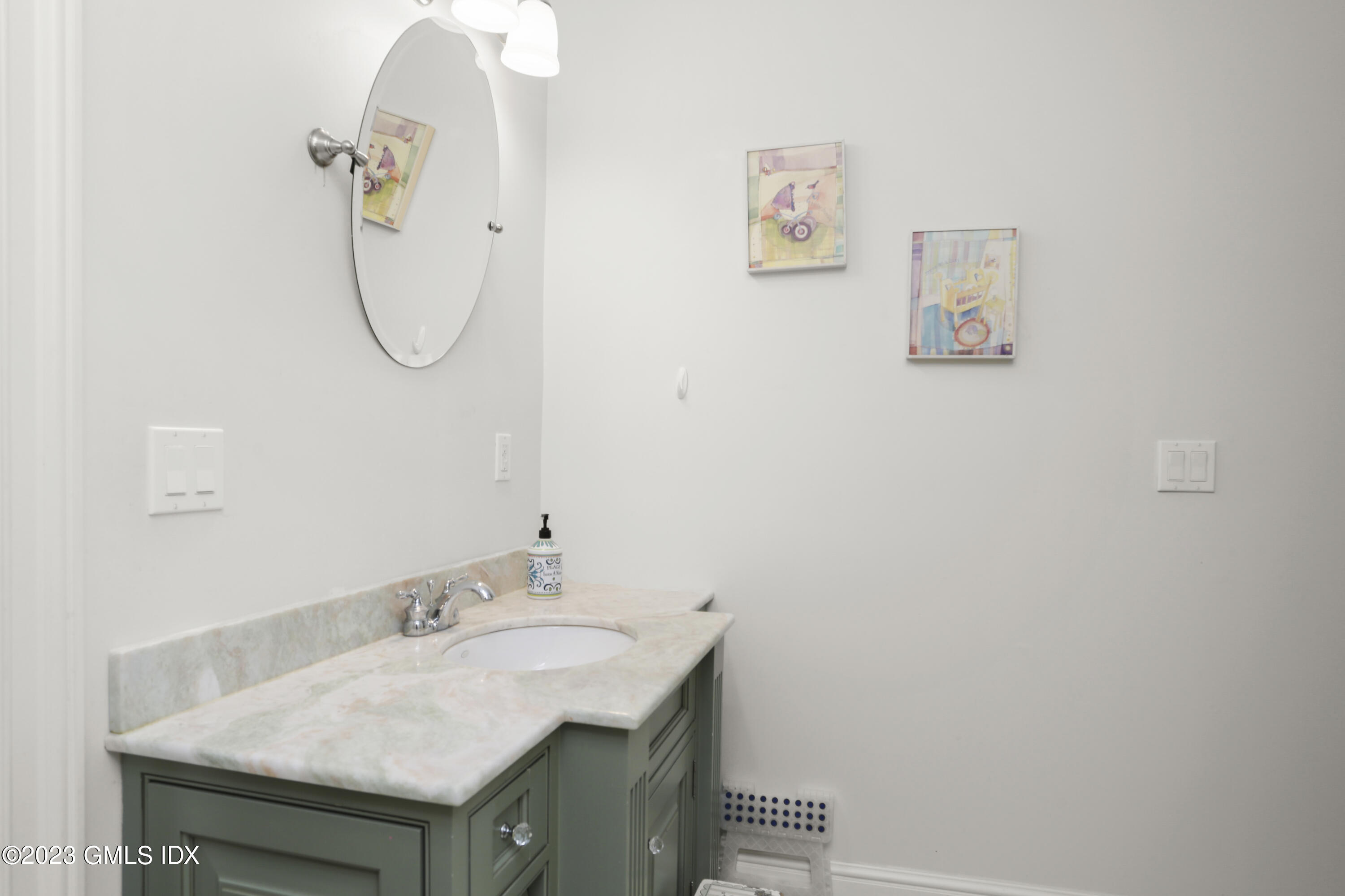 80 Brookside Drive Greenwich, CT 06831 - Photo 15 of 29 a bathroom with a sink and a mirror