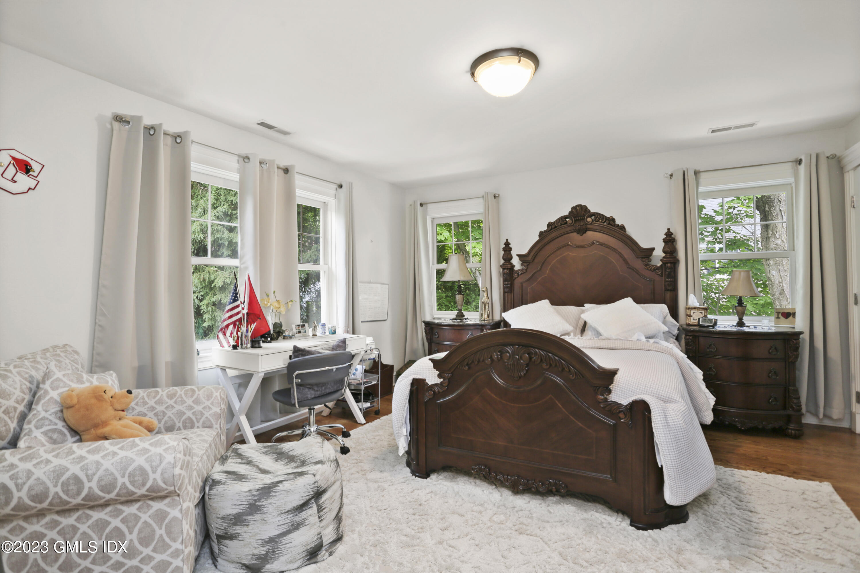 80 Brookside Drive Greenwich, CT 06831 - Photo 16 of 29 a bedroom with a bed and wooden floor