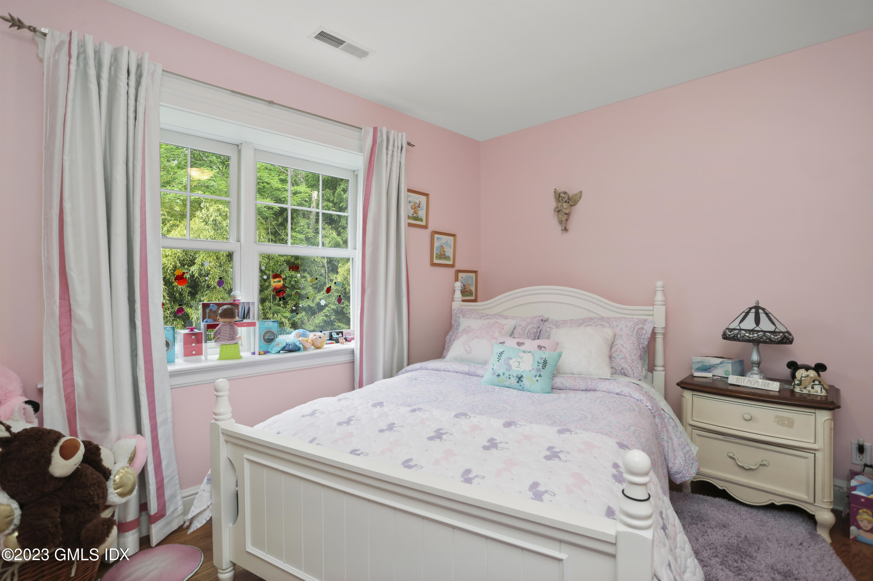 80 Brookside Drive Greenwich, CT 06831 - Photo 18 of 29 a bedroom with a bed and a window