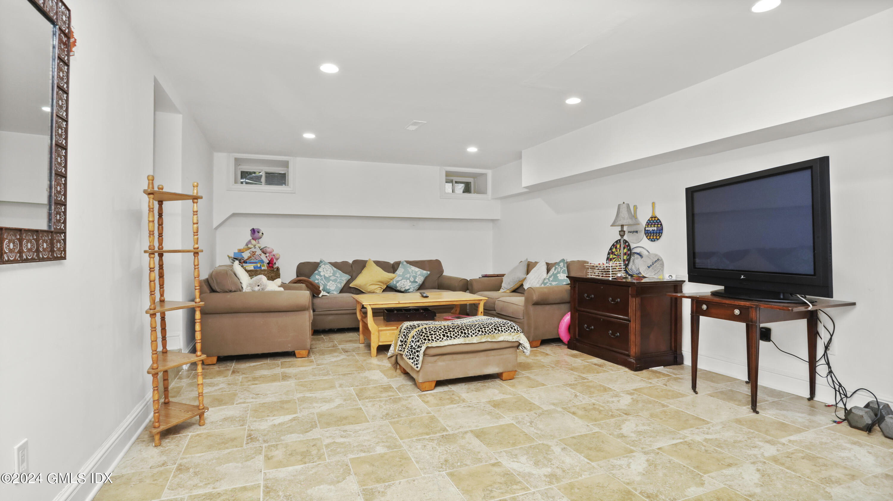 80 Brookside Drive Greenwich, CT 06831 - Photo 19 of 29 a living room with furniture and a flat screen tv