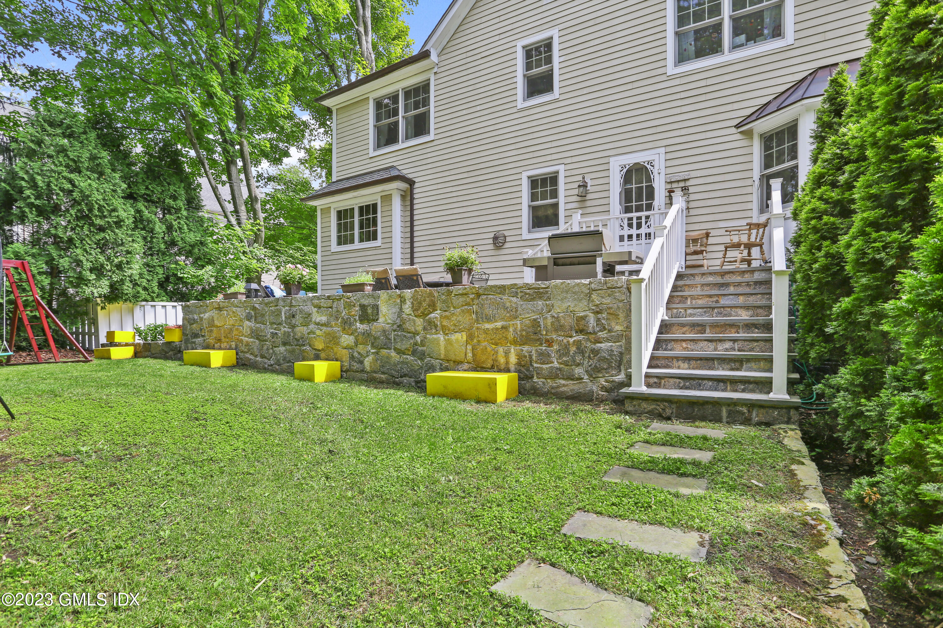 80 Brookside Drive Greenwich, CT 06831 - Photo 23 of 29 a view of a house with a backyard
