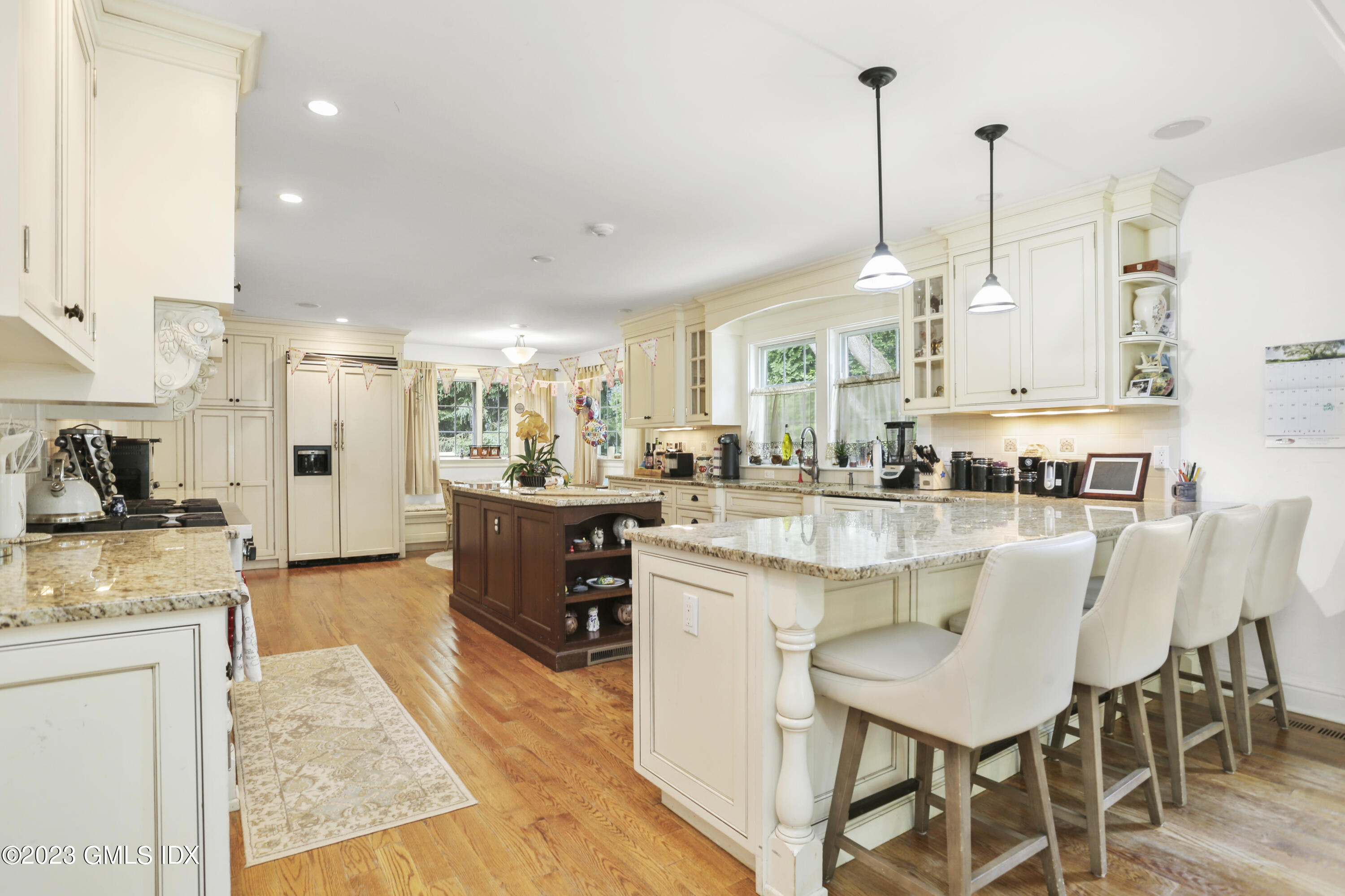 80 Brookside Drive Greenwich, CT 06831 - Photo 4 of 29 a large kitchen with kitchen island a large counter top appliances and cabinets