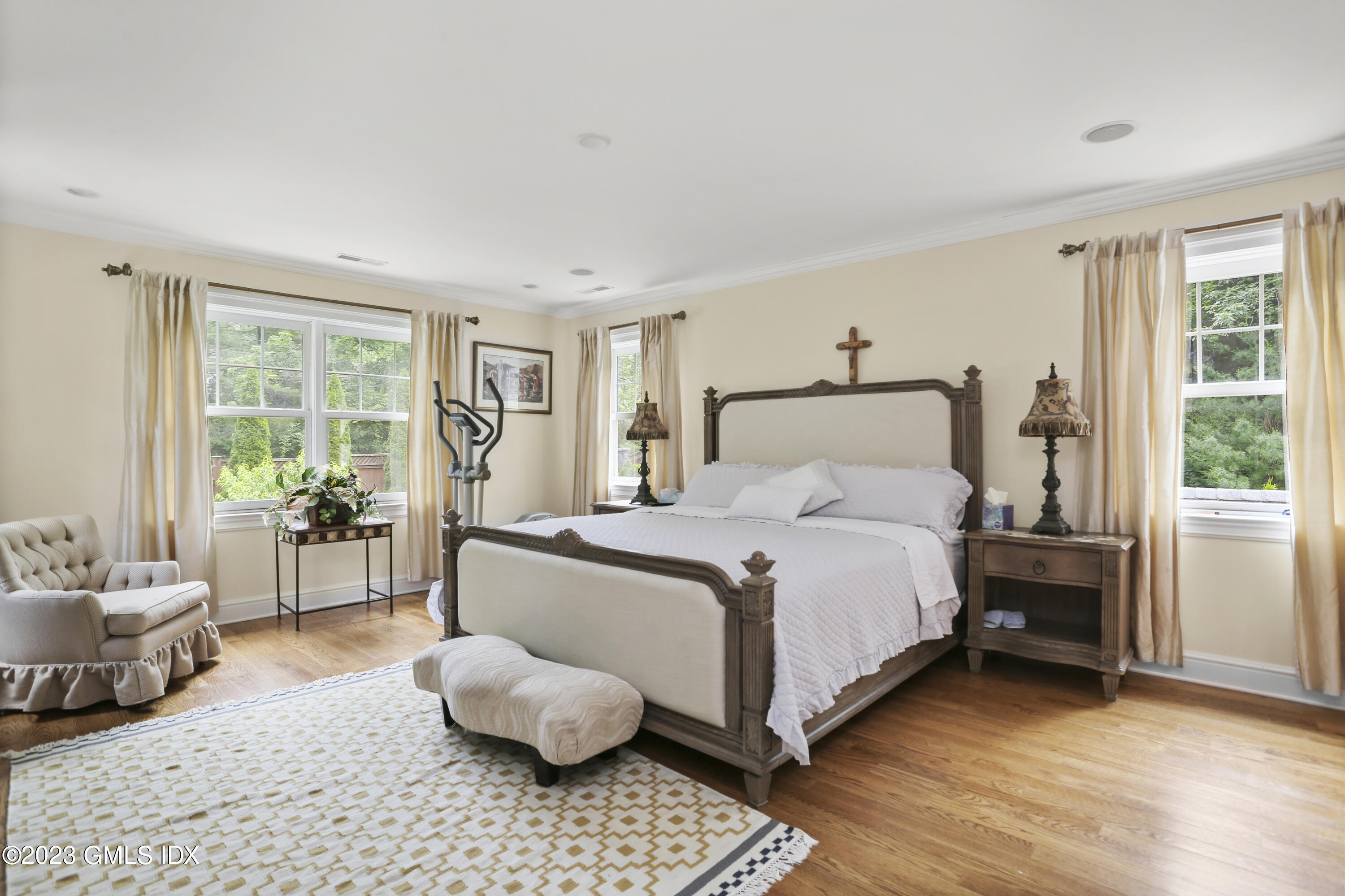 80 Brookside Drive Greenwich, CT 06831 - Photo 10 of 29 a bedroom with a bed and wooden floor