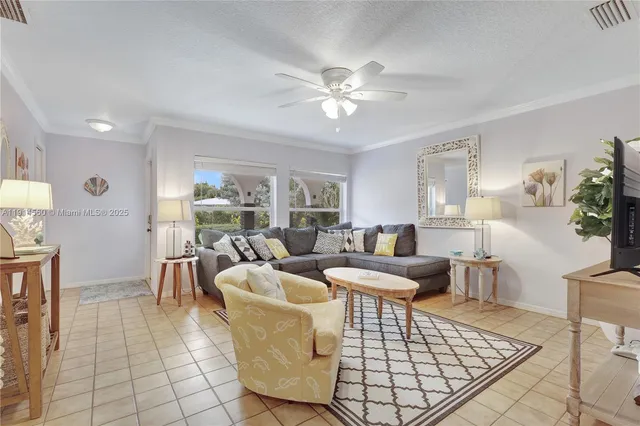 a living room with furniture a dining table and a fireplace