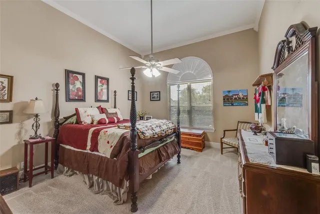 a bed room with a bed and a chandelier