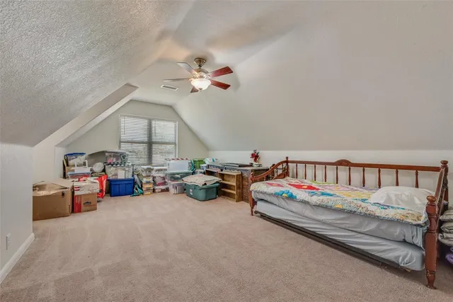 a bedroom with furniture and a chandelier