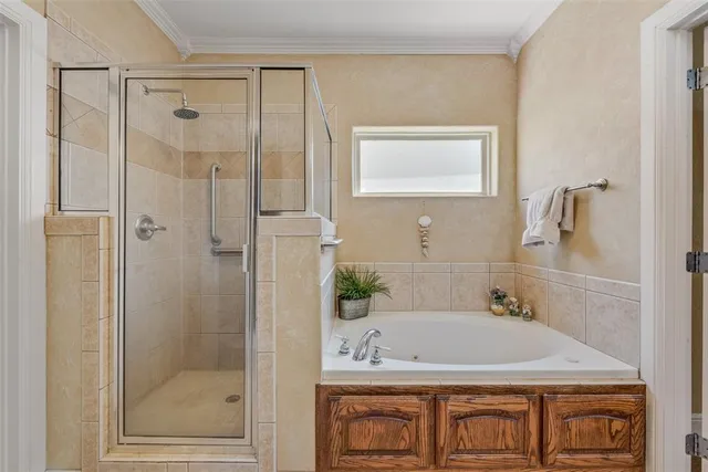 a bathroom with a granite countertop shower a mirror and a sink