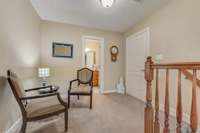 a view of a livingroom with furniture and a chair