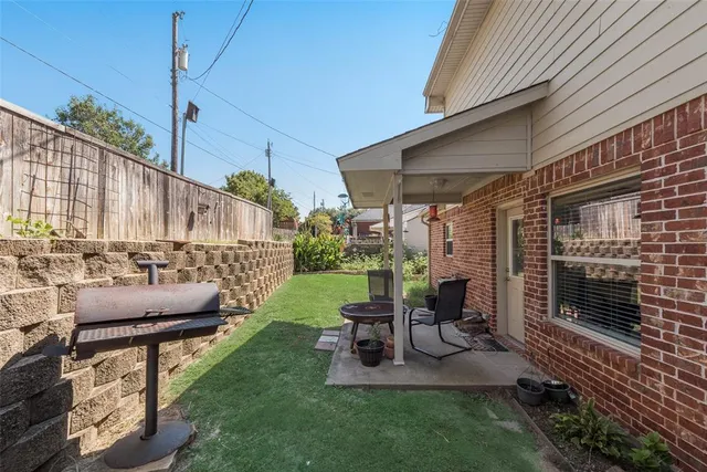 a view of a patio with couches chairs couches and a fire pit