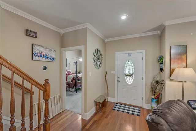 a bedroom with furniture and a window