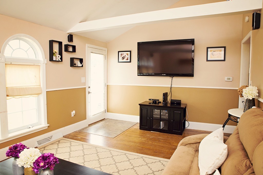 91 Lafayette Road Salisbury, MA 01952 - Photo 7 of 17 a living room with furniture and a flat screen tv