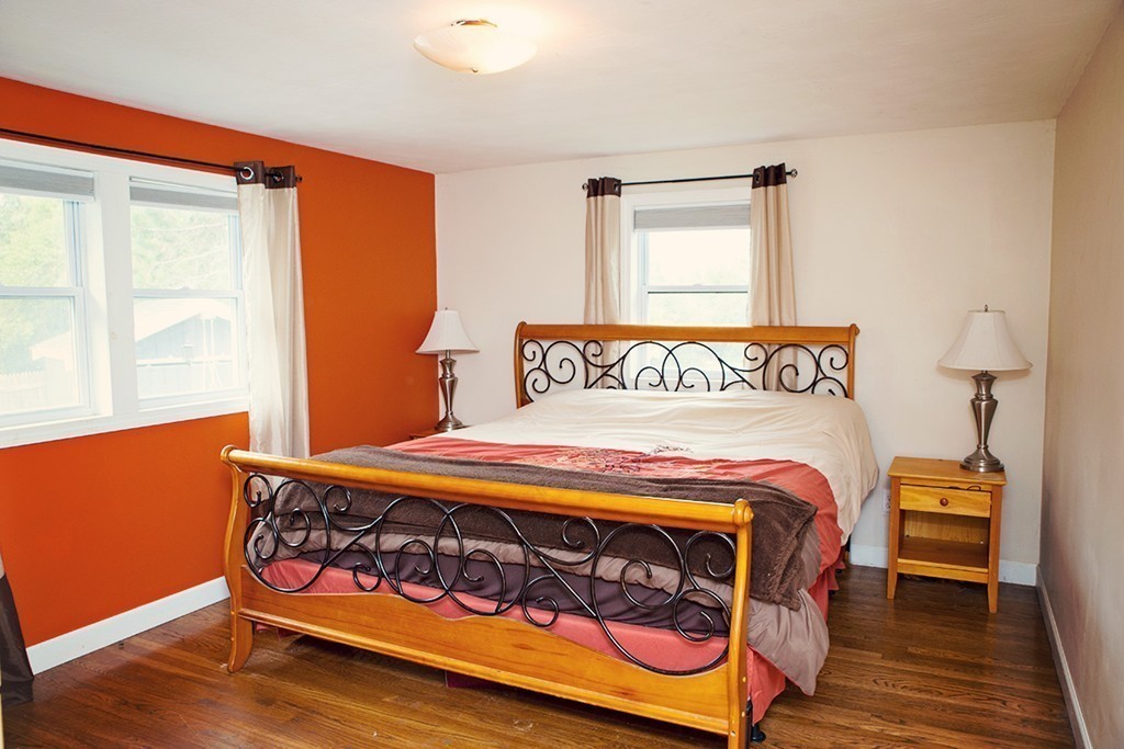 91 Lafayette Road Salisbury, MA 01952 - Photo 8 of 17 a bed sitting in a bedroom next to a window