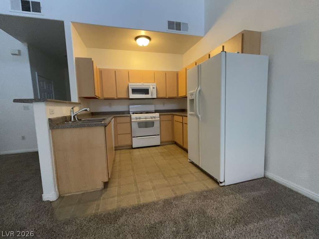 4915 East Russell Road, Unit 142 Las Vegas, NV 89120 - Photo 4 of 10 A well-appointed kitchen features ample cabinetry and a practical layout for daily living.