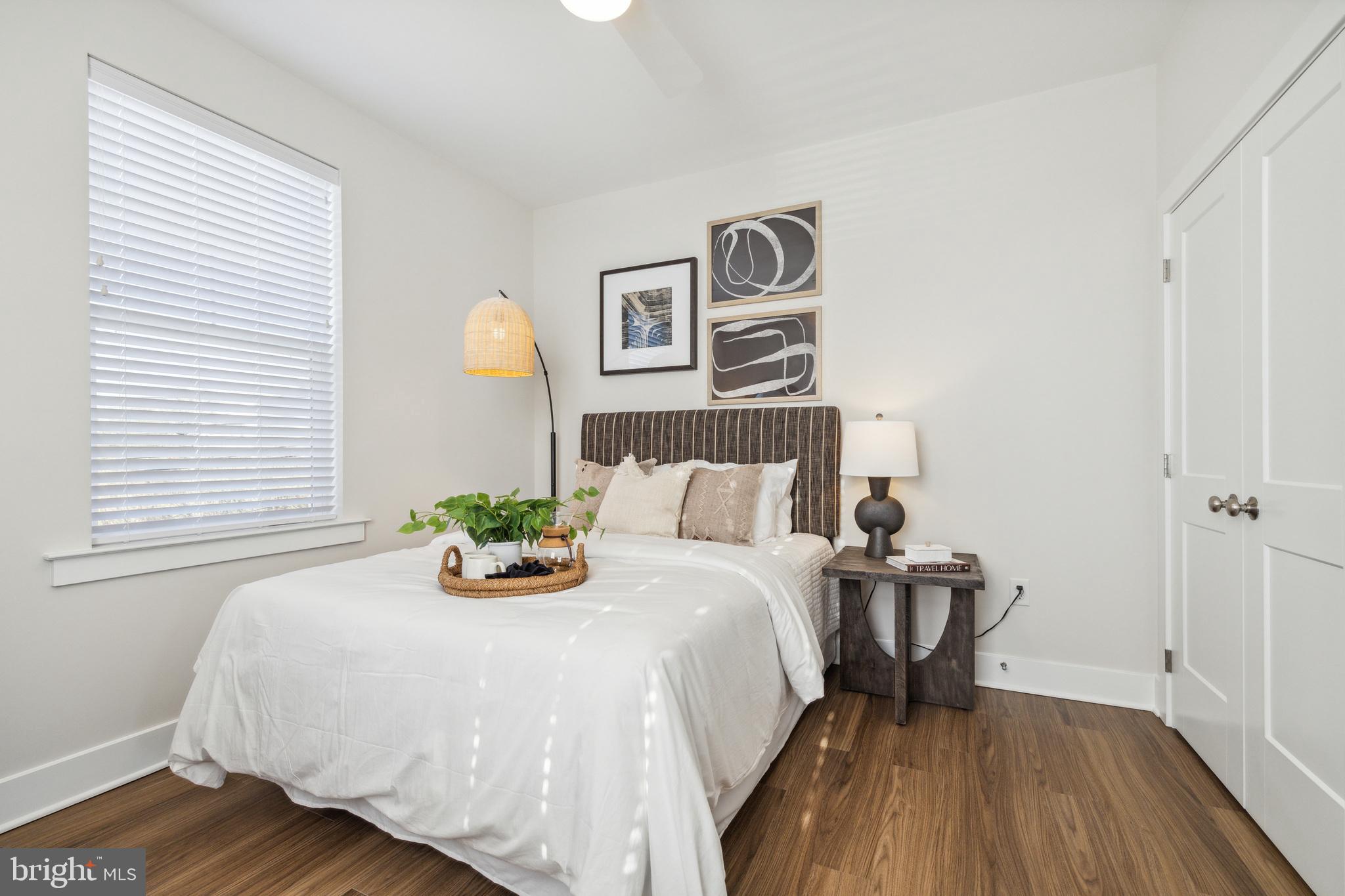 17 Mainland Road, Unit 216 Harleysville, PA 19438 - Photo 11 of 23 a bedroom with a bed and wooden floor
