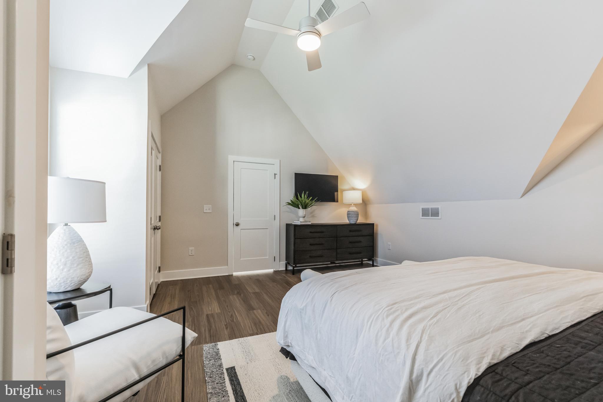 17 Mainland Road, Unit 216 Harleysville, PA 19438 - Photo 15 of 23 a bedroom with a large bed and a flat screen tv