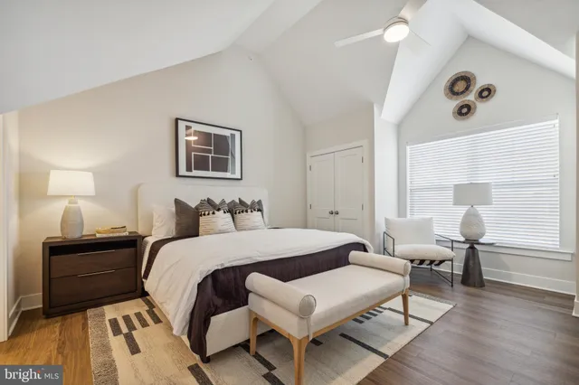 a bedroom with a bed and a table