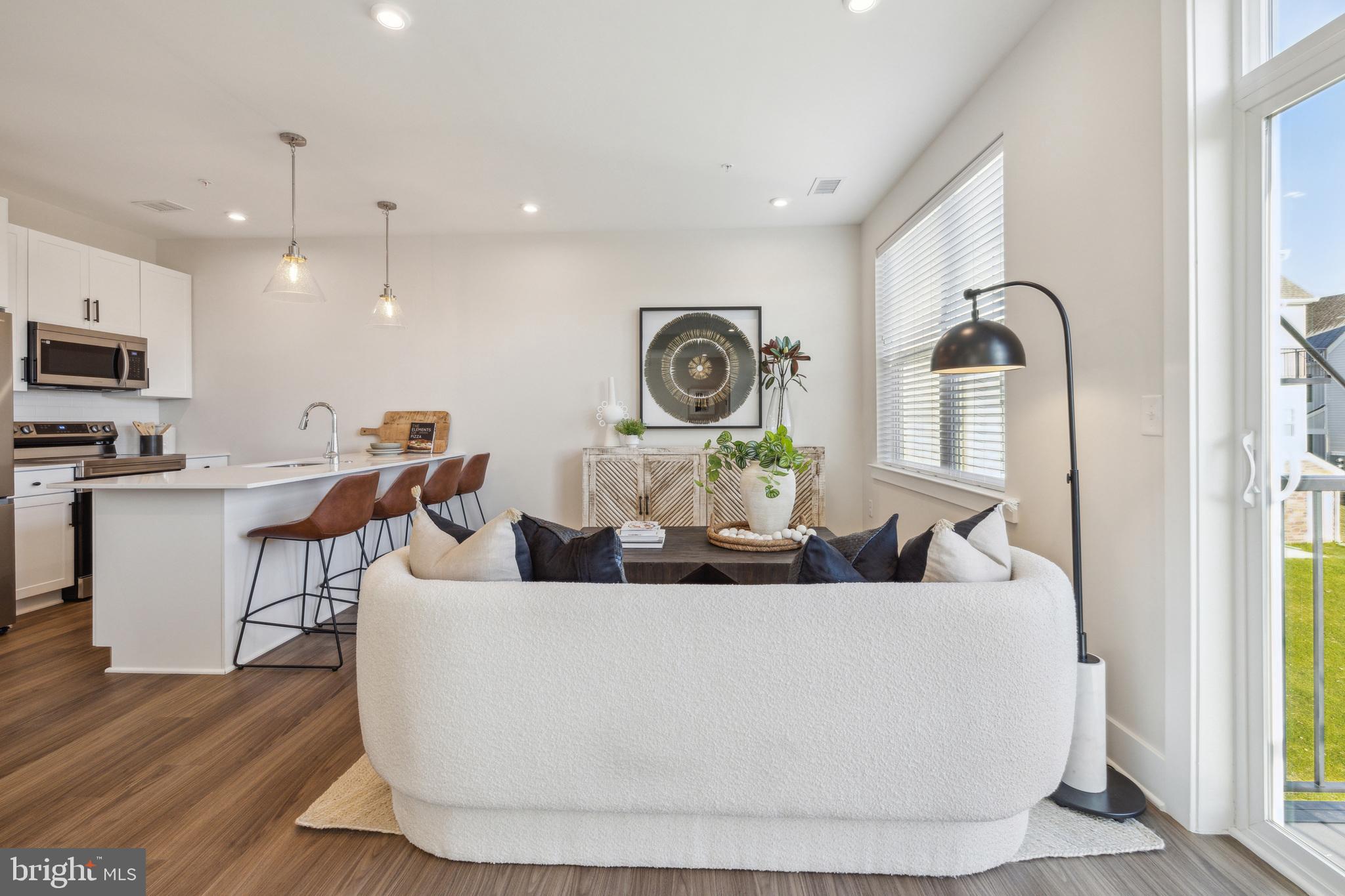 17 Mainland Road, Unit 216 Harleysville, PA 19438 - Photo 2 of 23 a living room with furniture and wooden floor