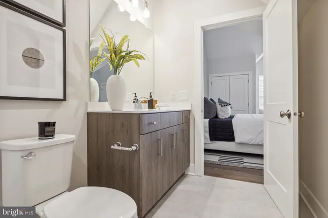 a bedroom with a bed and flat screen tv