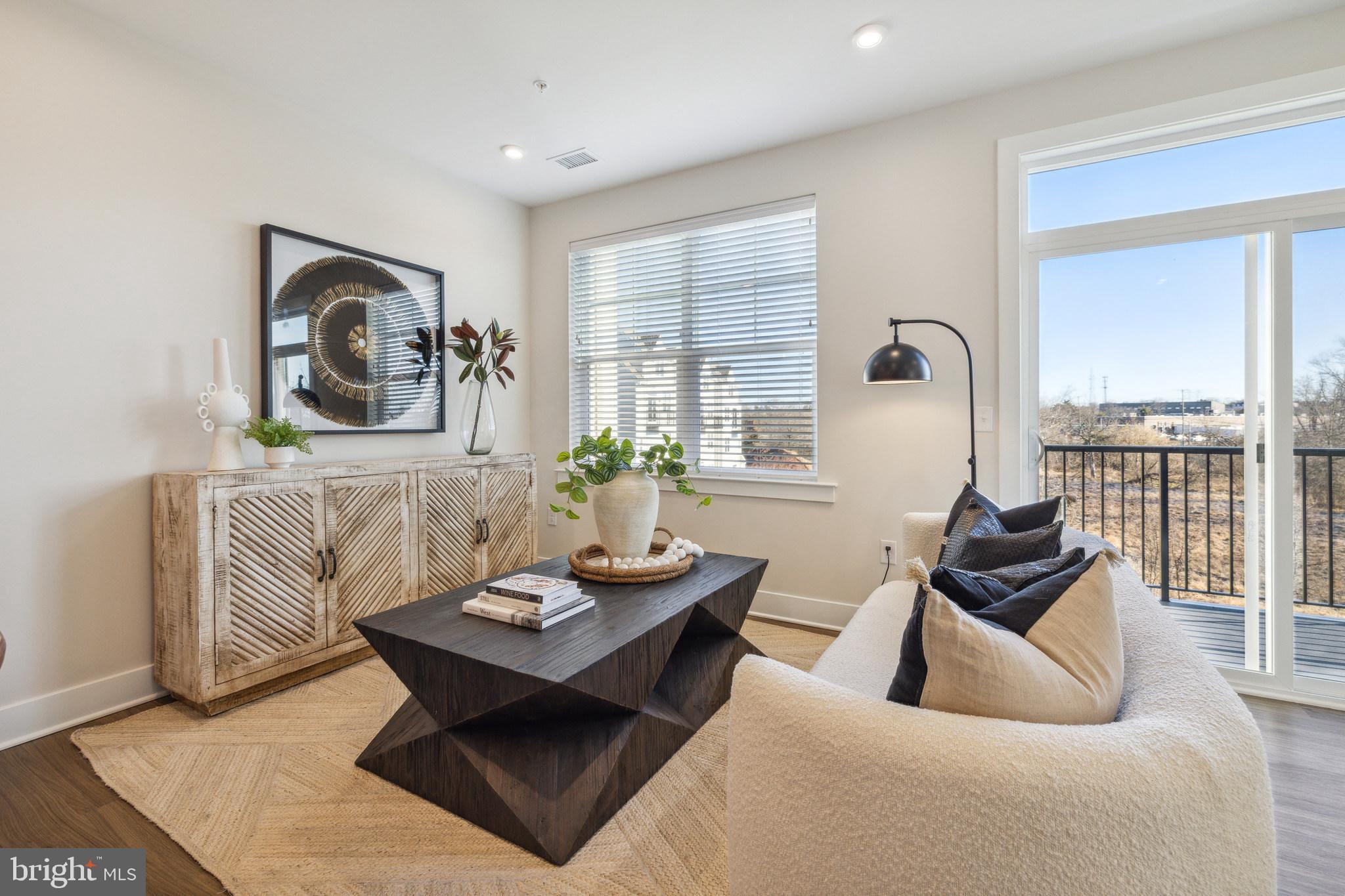17 Mainland Road, Unit 216 Harleysville, PA 19438 - Photo 4 of 23 a living room with furniture and a large window
