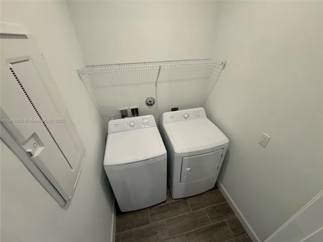 a view of storage and utility room with utility room