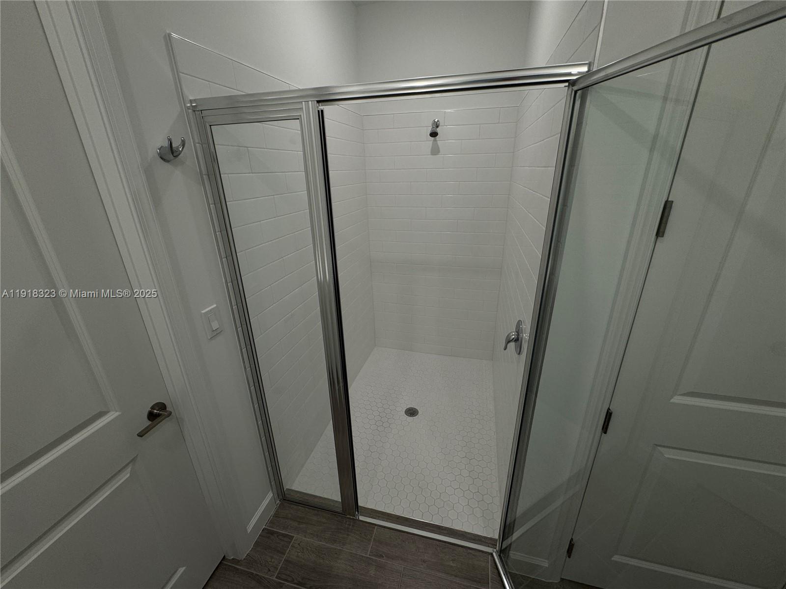 5726 Divine Drive, Unit 5726 Delray Beach, FL 33484 - Photo 32 of 44 a bathroom with a glass shower door and a sink