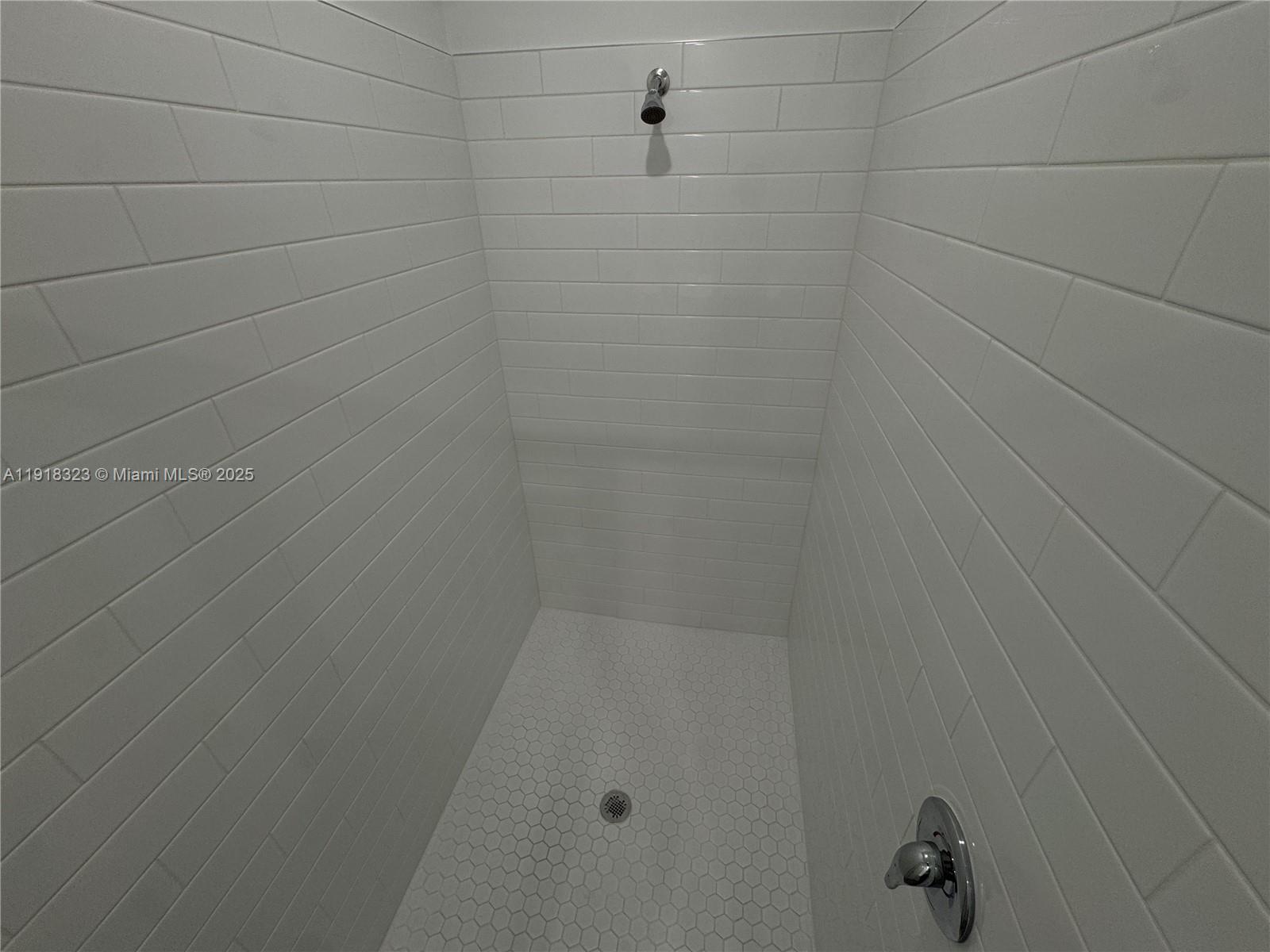 5726 Divine Drive, Unit 5726 Delray Beach, FL 33484 - Photo 33 of 44 a bathroom with a shower