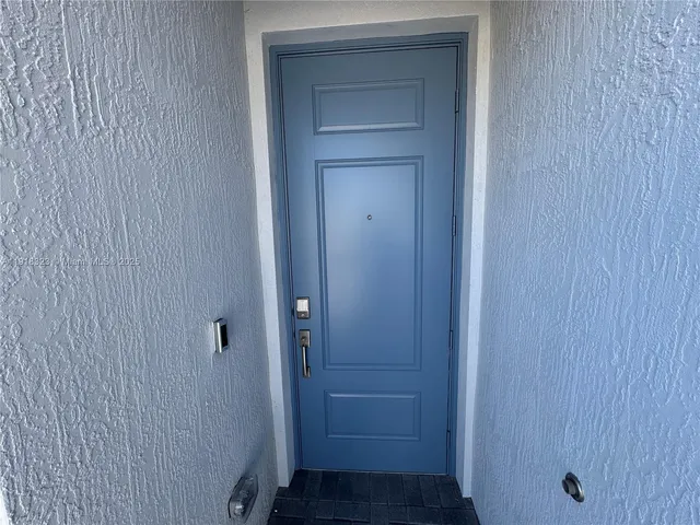 a view of a hallway with a door
