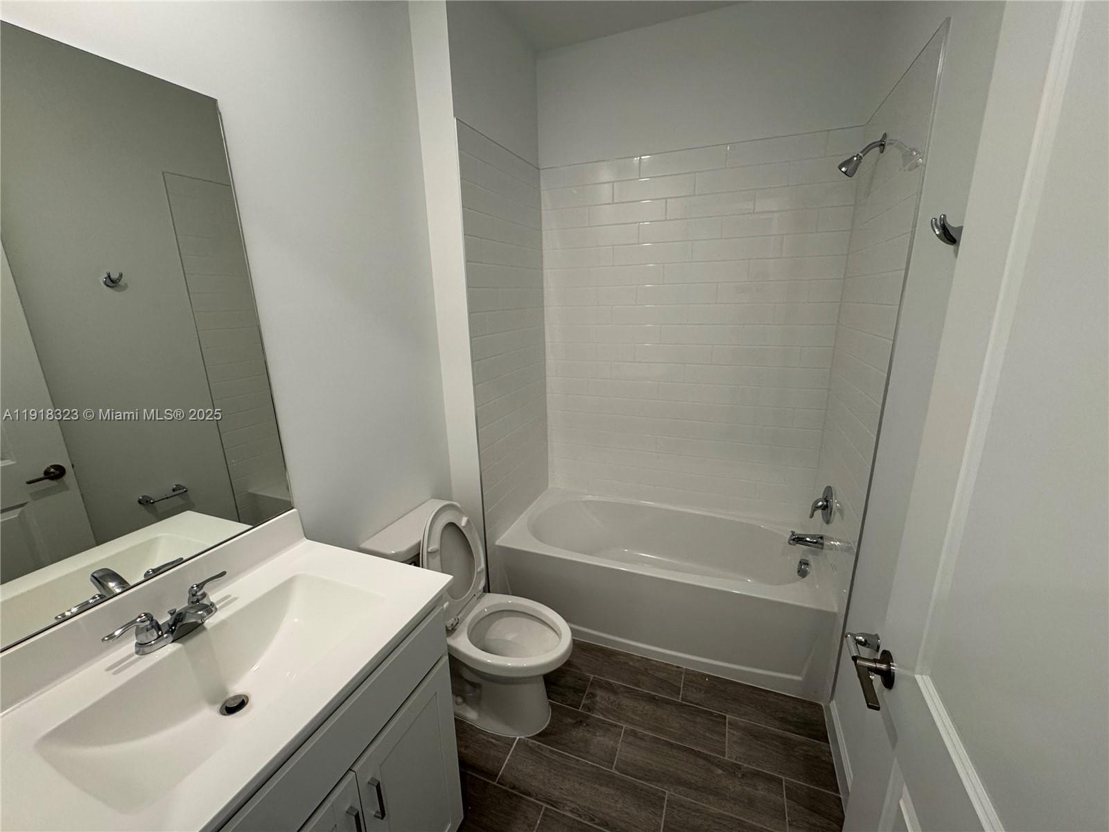 5726 Divine Drive, Unit 5726 Delray Beach, FL 33484 - Photo 7 of 44 a bathroom with a sink toilet and shower