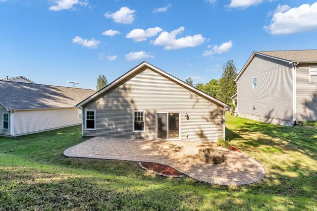 a view of a house with a yard