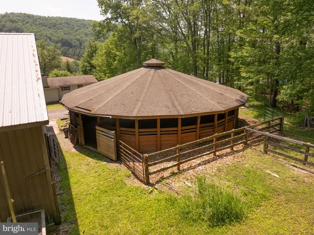 a view of a backyard with a tub and trees