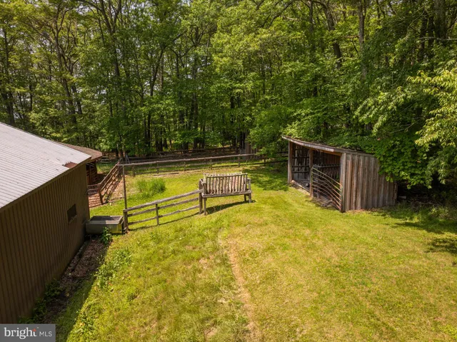 a view of a backyard with swimming pool