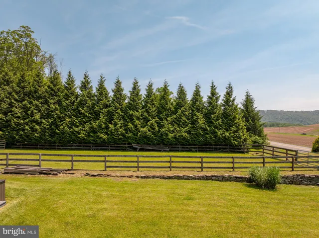 a view of a swimming pool and an outdoor space