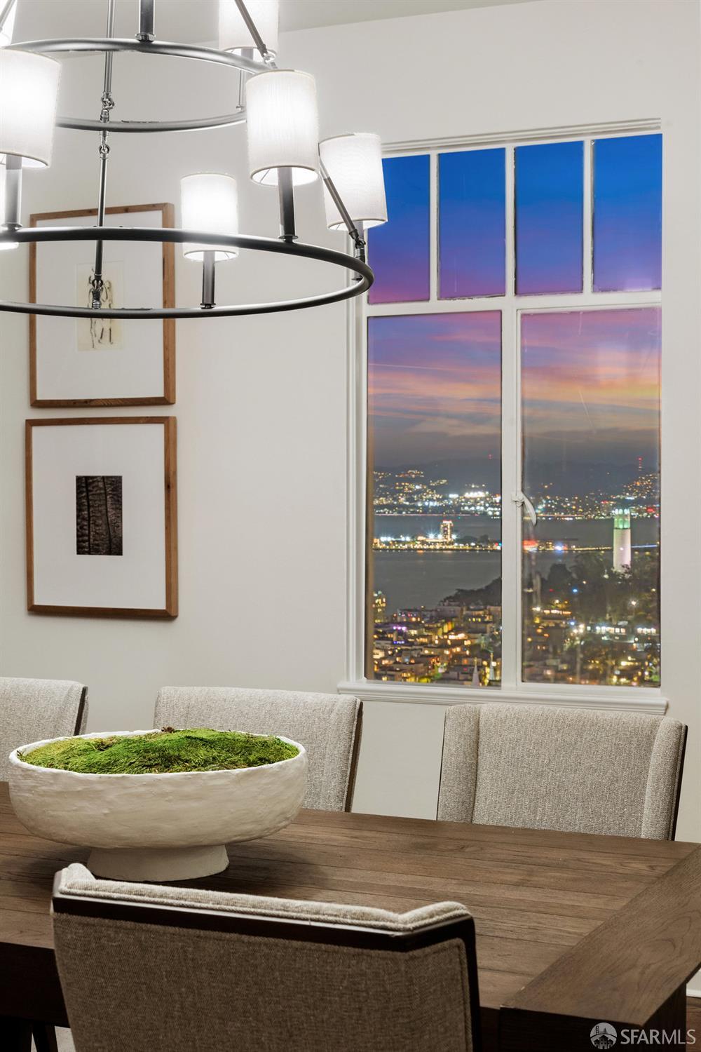 1101 Green Street, Unit 1801 San Francisco, CA 94109 - Photo 14 of 45 a living room with a couch and a floor to ceiling window