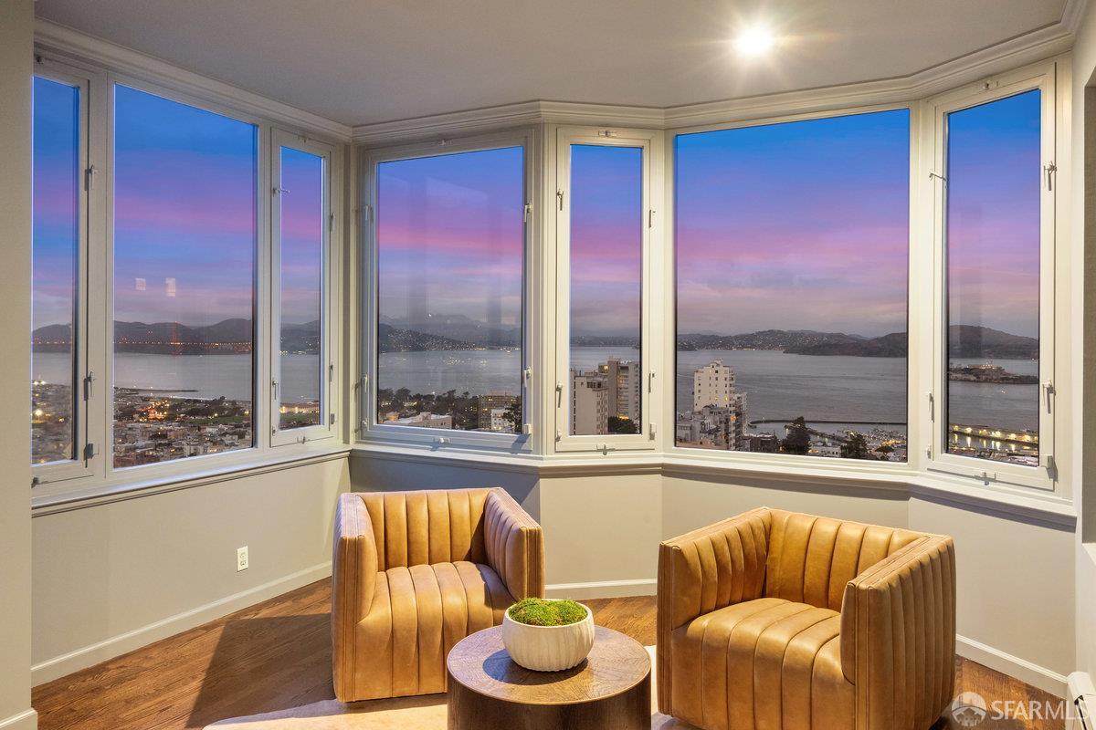 1101 Green Street, Unit 1801 San Francisco, CA 94109 - Photo 20 of 45 a living room with furniture and a large window
