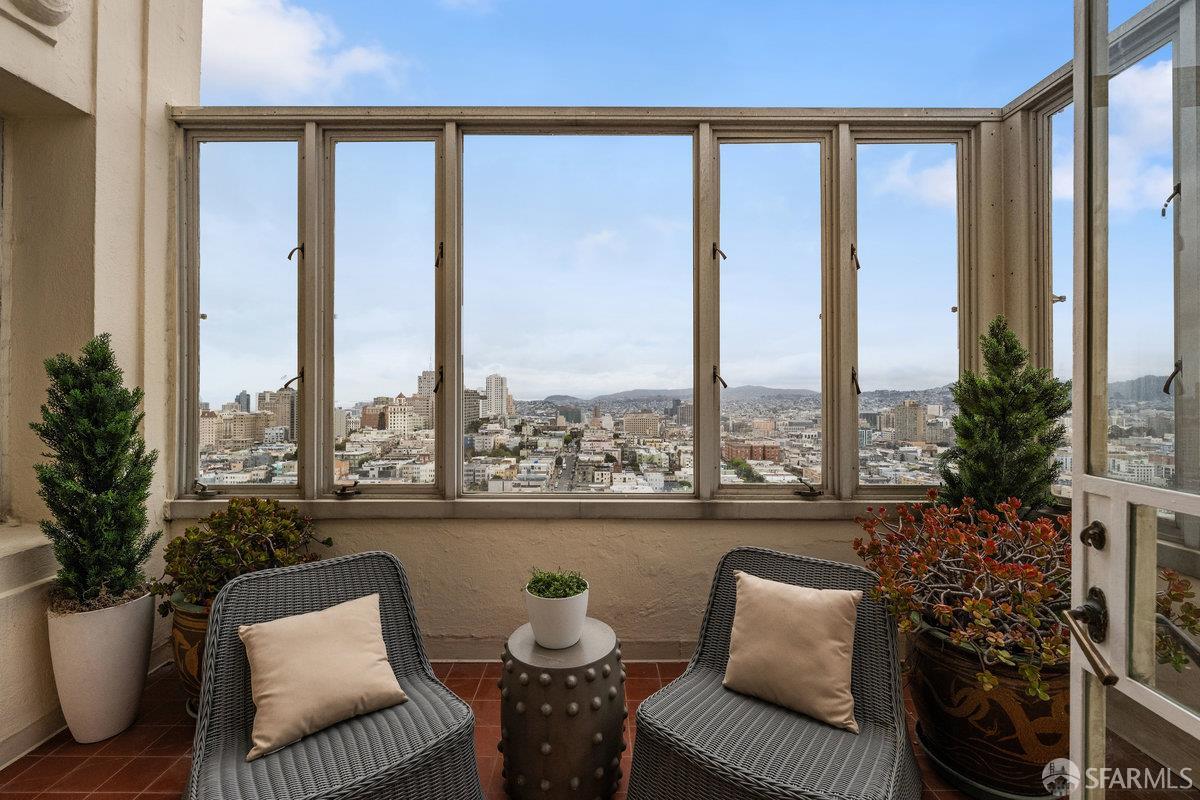 1101 Green Street, Unit 1801 San Francisco, CA 94109 - Photo 30 of 45 a balcony with furniture and a potted plant