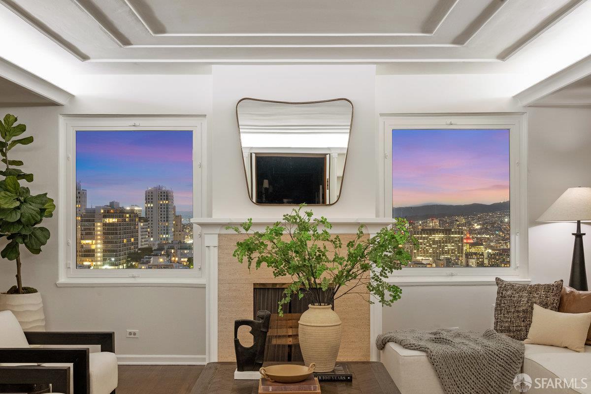 1101 Green Street, Unit 1801 San Francisco, CA 94109 - Photo 33 of 45 a living room with furniture fireplace and a flat screen tv