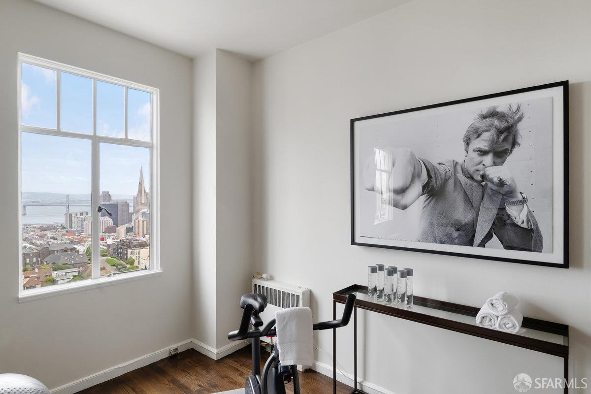 1101 Green Street, Unit 1801 San Francisco, CA 94109 - Photo 45 of 45 a room with furniture and wooden floor