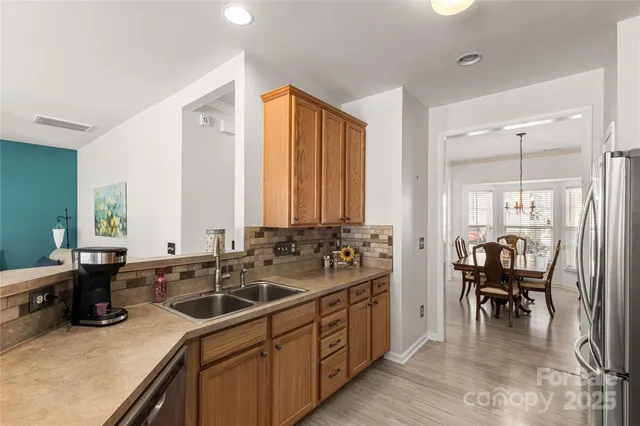 a kitchen with a sink and a large window