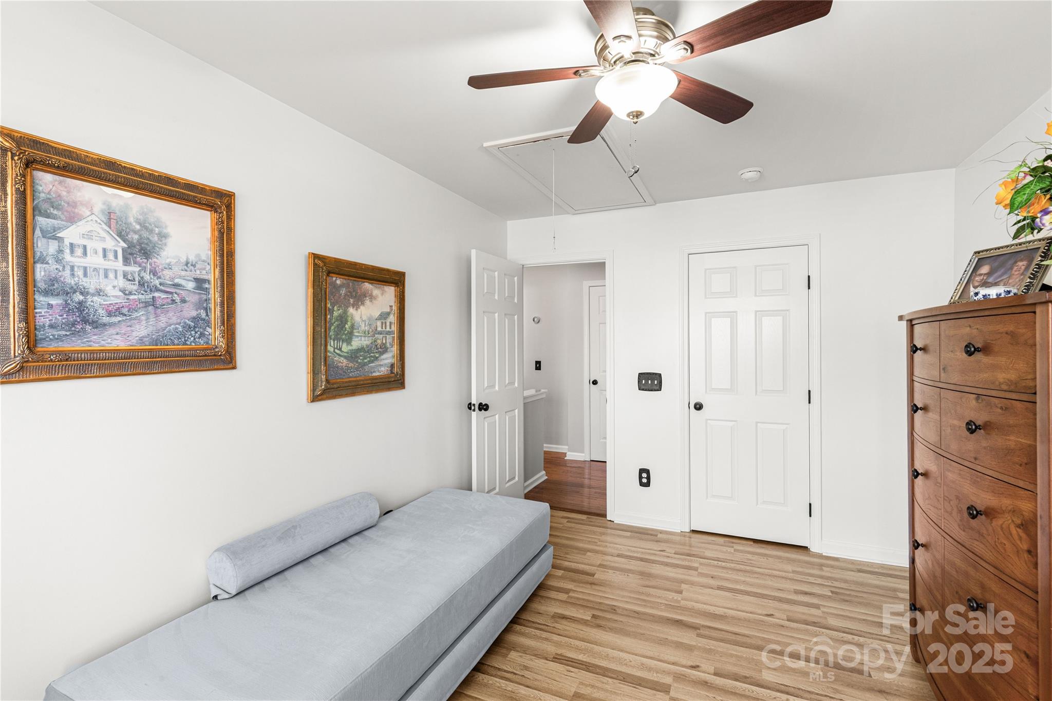 324 Dusk Drive Rock Hill, SC 29732 - Photo 19 of 39 a spacious bedroom with a bed and a chandelier