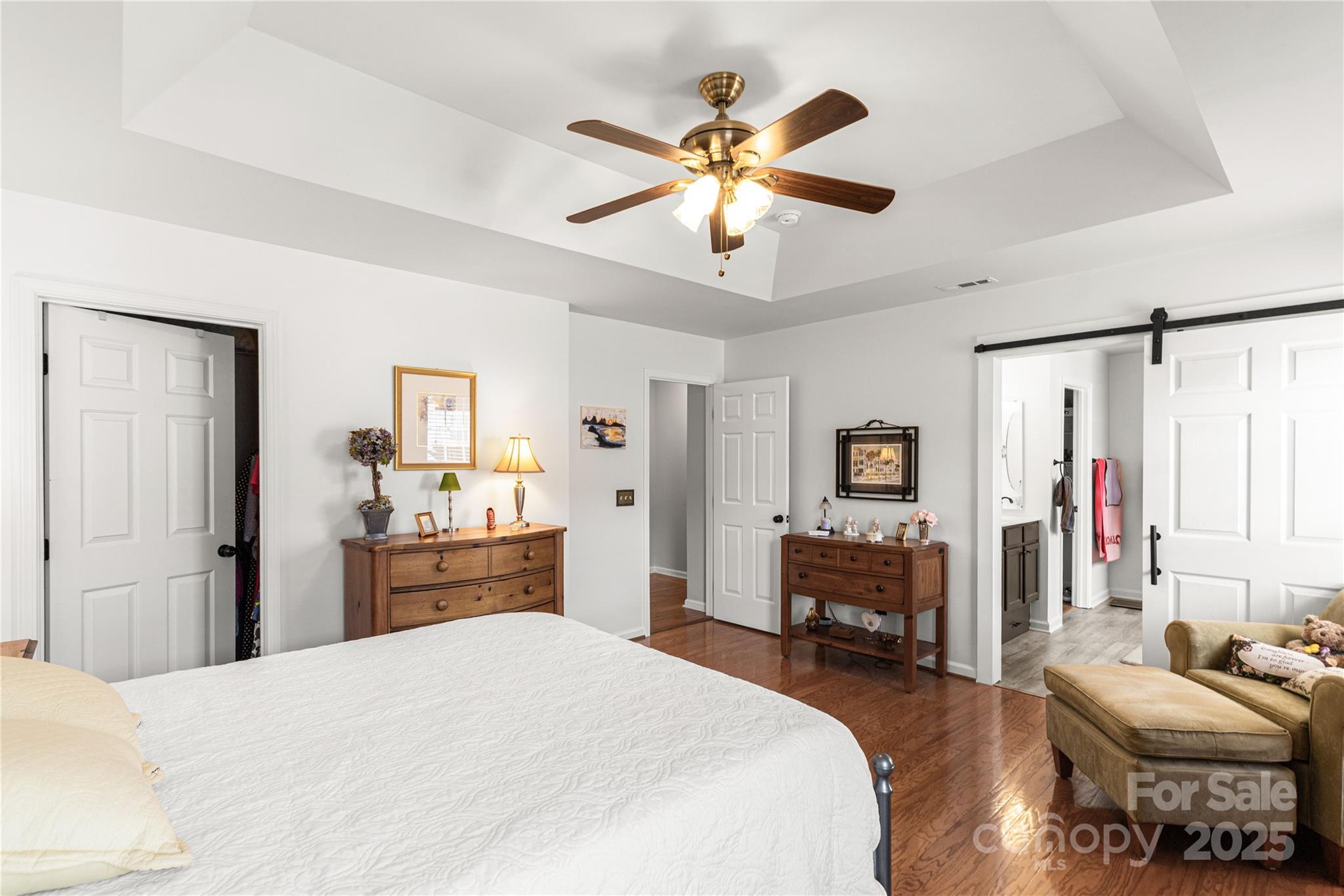 324 Dusk Drive Rock Hill, SC 29732 - Photo 21 of 39 a bedroom with a bed and a chandelier