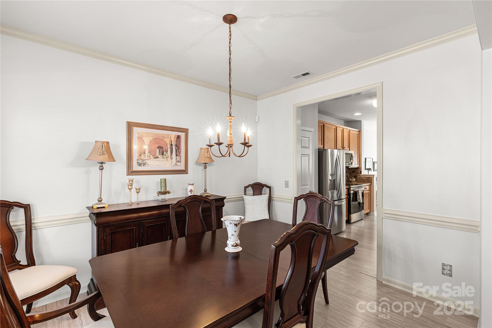 324 Dusk Drive Rock Hill, SC 29732 - Photo 6 of 39 a view of a dining room with furniture and chandelier
