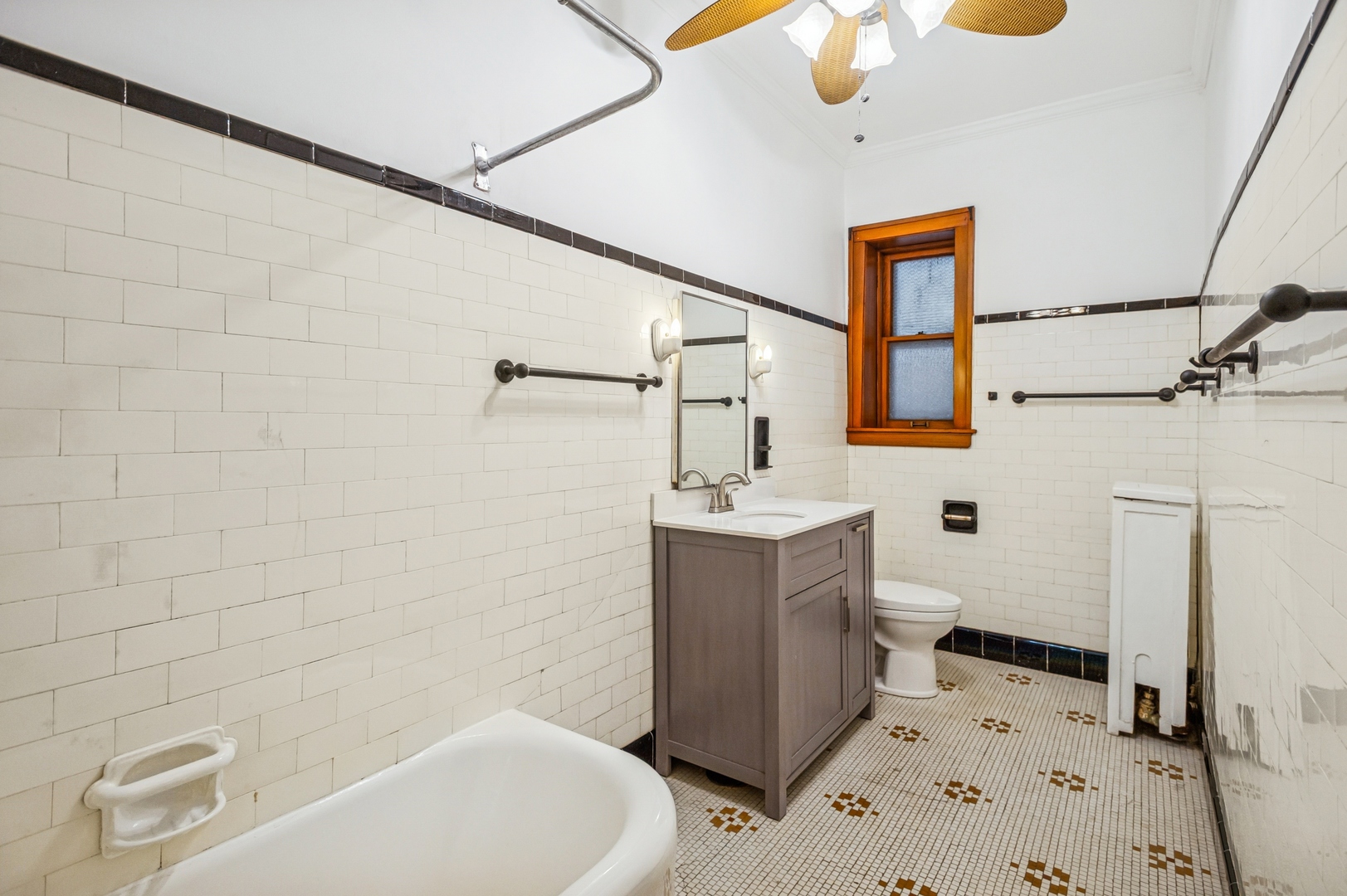 672 West Irving Park Road, Unit G2 Chicago, IL 60613 - Photo 13 of 25 a bathroom with a sink a toilet and shower