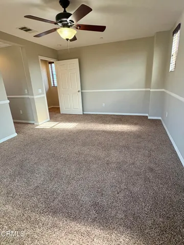 a spacious bathroom with a vanity a sink a mirror and a bathtub